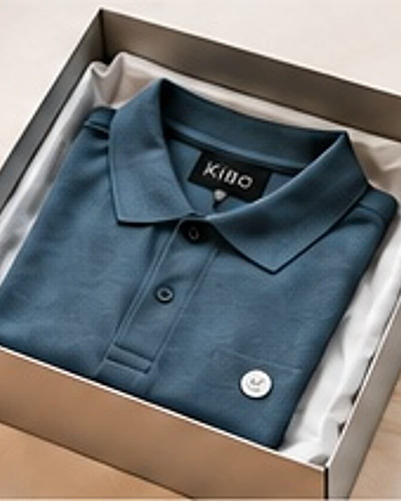 A finished folded polo shirt packaged in a box, with a KIBO label