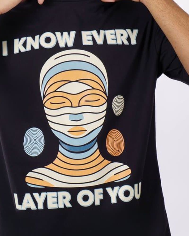 Close-up of a bold abstract graphic print on a dark t-shirt